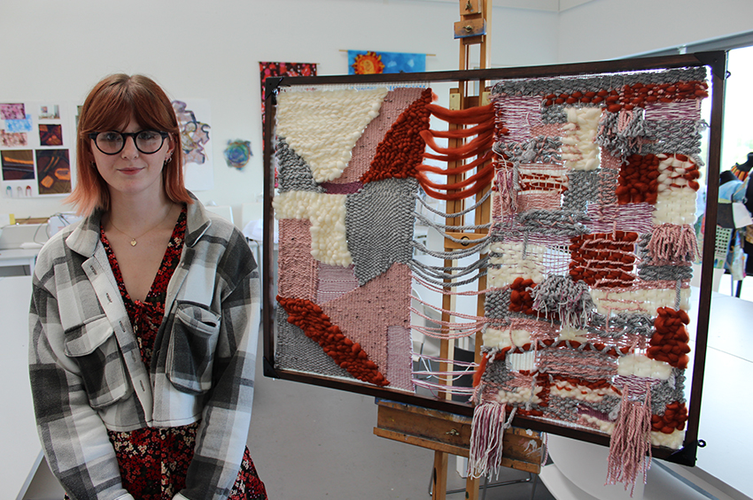 Katherine Graham in front of textile work / Forth Valley College