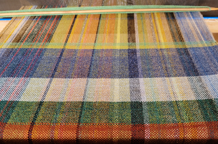 Woven textile on the loom