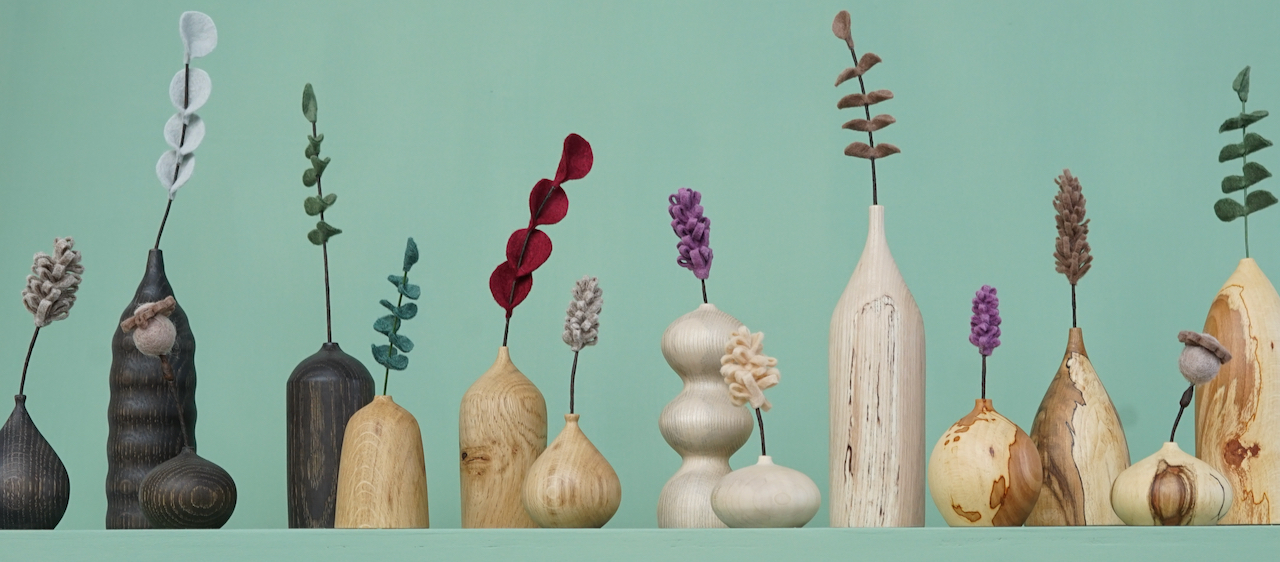 Free form vases with felt flowers.